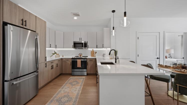 Side view of a kitchen with large island