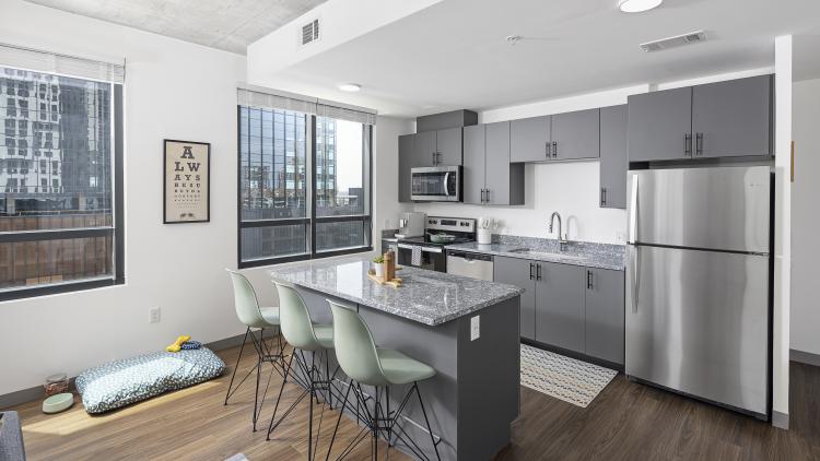 Kitchen with granite countertops and island