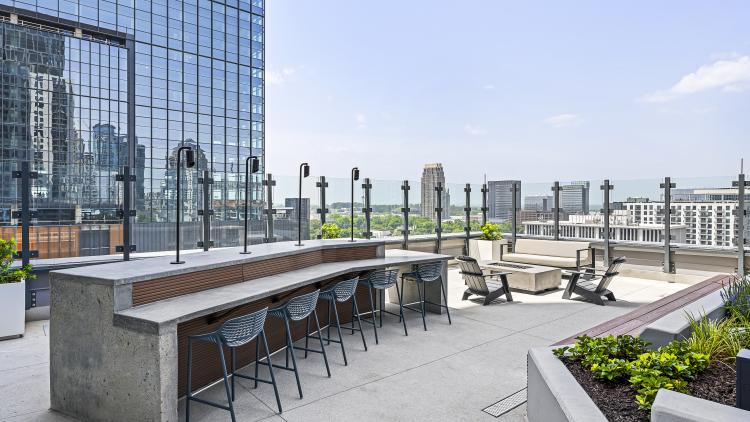 Outdoor courtyard with counter and stools