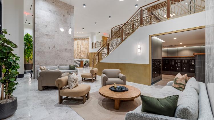 Large room with tall ceilings and sofas