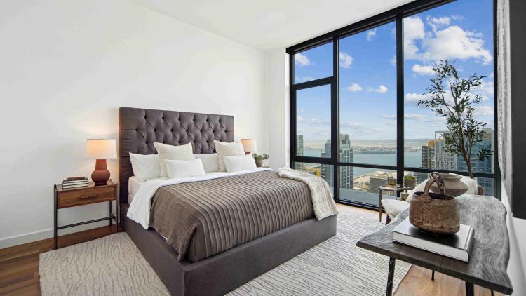 Bedroom with a large wall of windows