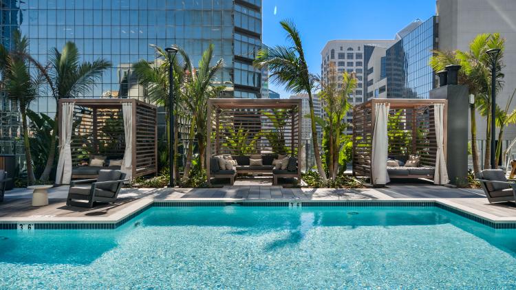 Pool with three covered cabanas