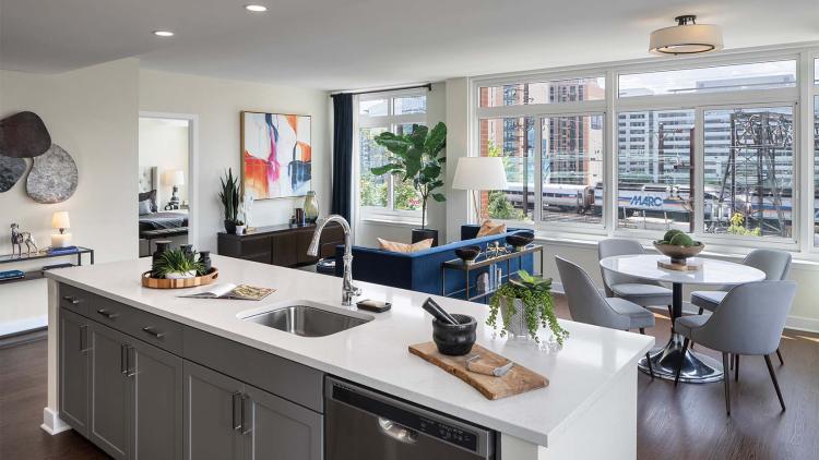 Kitchen with large island overlooking living room