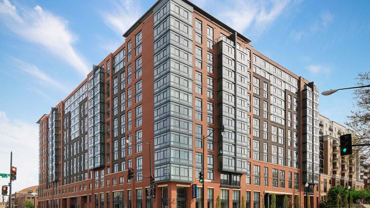 Exterior shot of red brick apartment building