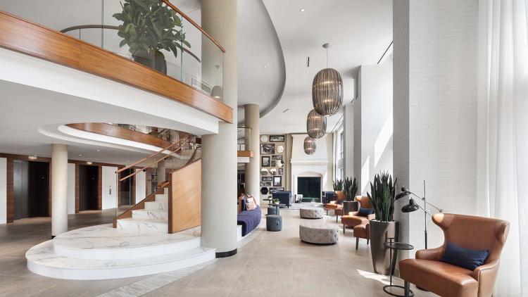 Lobby area with leather seating and large spiral staircase