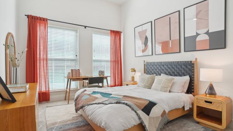 Bedroom with bed, headboard, nightstand, and dresser