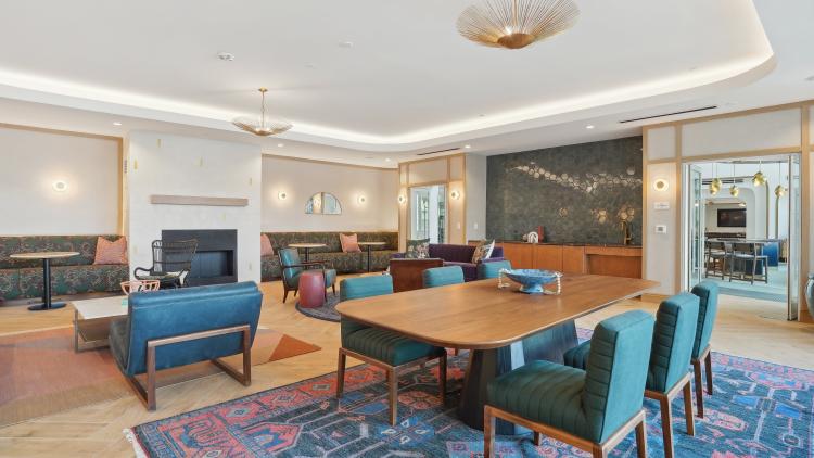 Large table with chairs and casual seating around