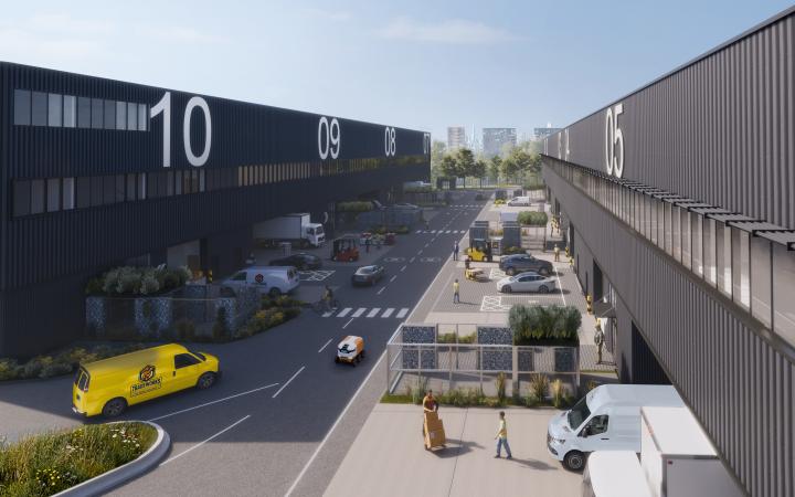 Rendering of two warehouses with cars and trucks on a road inbetween